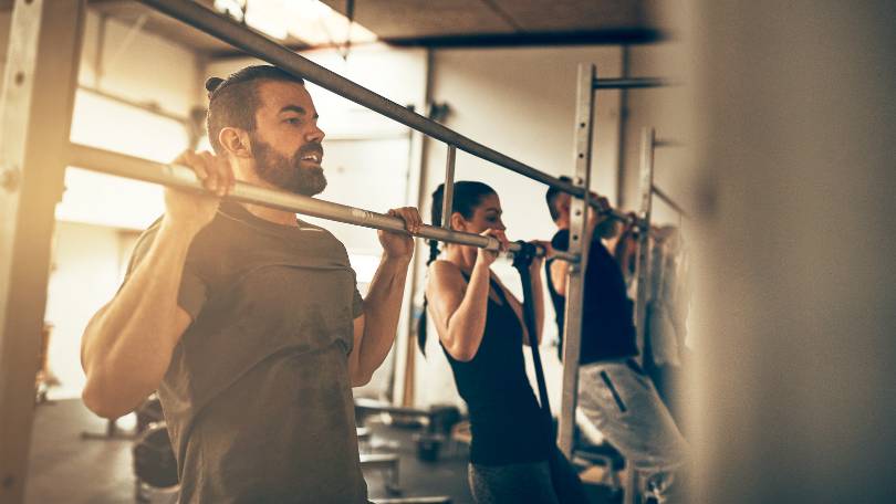 Fit People Doing Pull Ups in Apartment