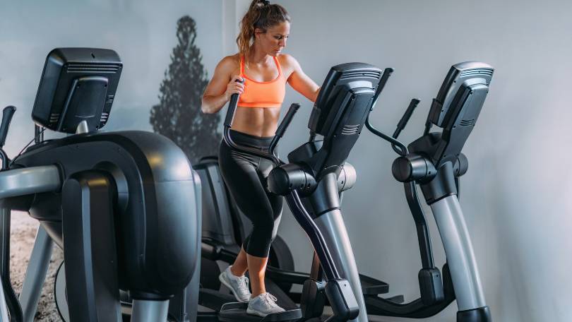 Woman Exercising on Elliptical Cross Trainer