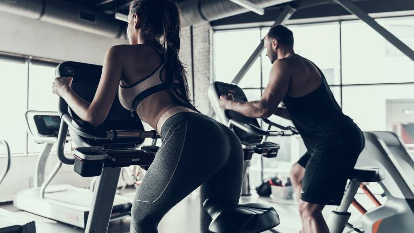 Couple Riding Exercise Bike
