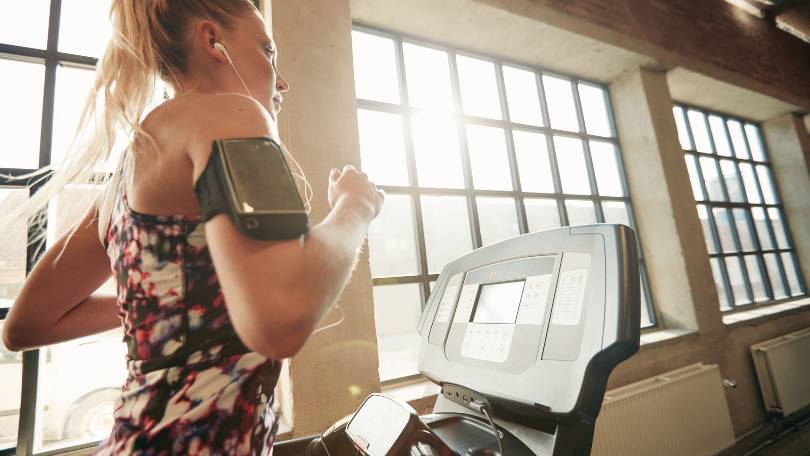 Female Working Out on Treadmill
