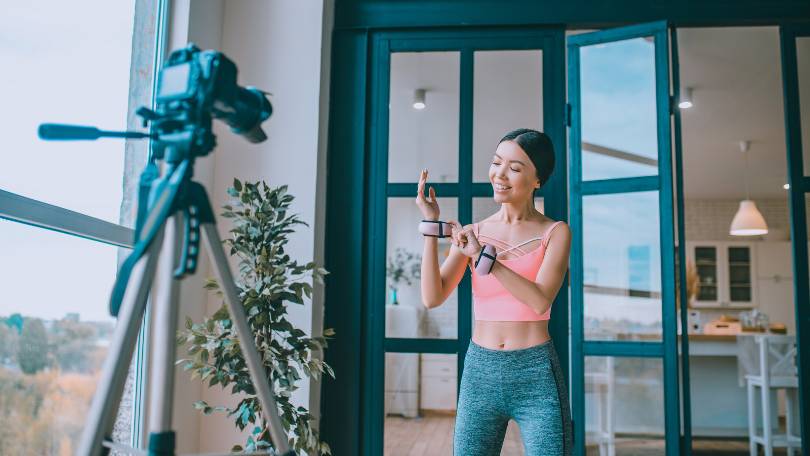 Fitness trainer showing her small arm wrist weights