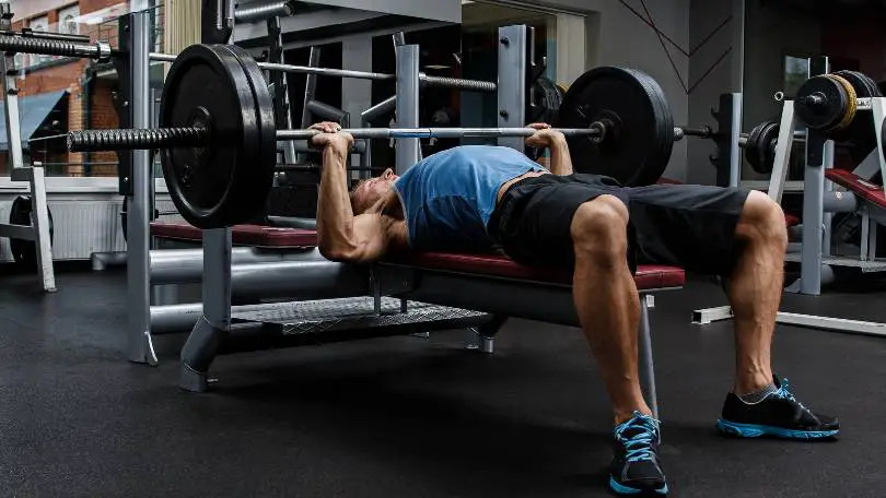 Man doing bench press on weight bench that has 1000 lb capacity